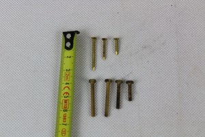 Thumbnail image of 4.4 kilos of assorted brass hexagonal screws (bolts) and tacks (pins)