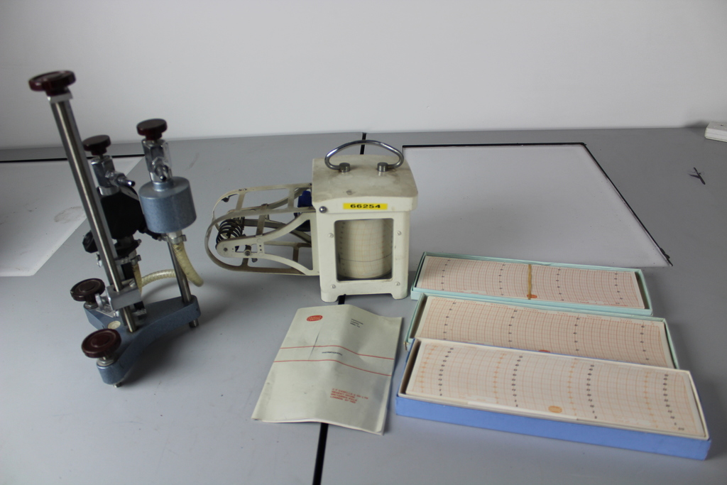 Image of Thermograph with instructions, 3 boxes of graph paper and additional item