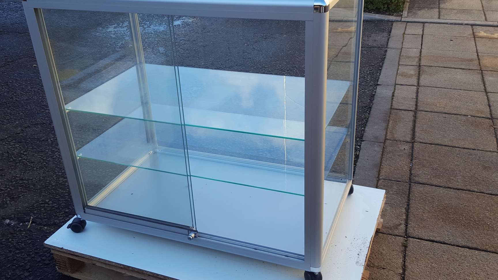Image of Superb Glass Display Cabinet on Wheels with Glass Shelves Large