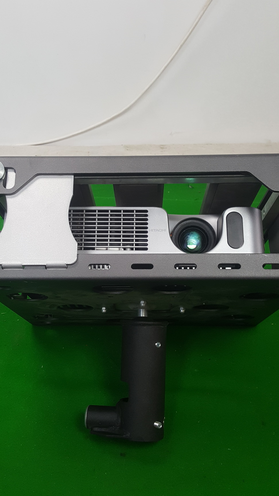 Image of Hitachi Ed-X12 Projector + Remote, Locked in Security Cage