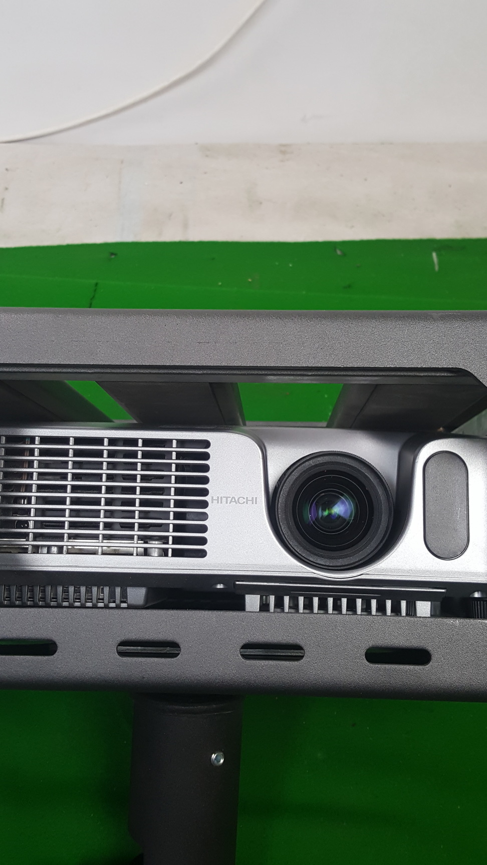 Image of Hitachi Ed-X12 Projector + Remote, Locked in Security Cage