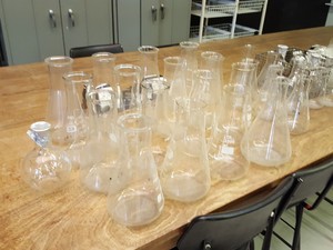 Thumbnail image of Large lot of Lab Glassware, Bottles, Test Tubes Measuring Cylinders Racks Flasks