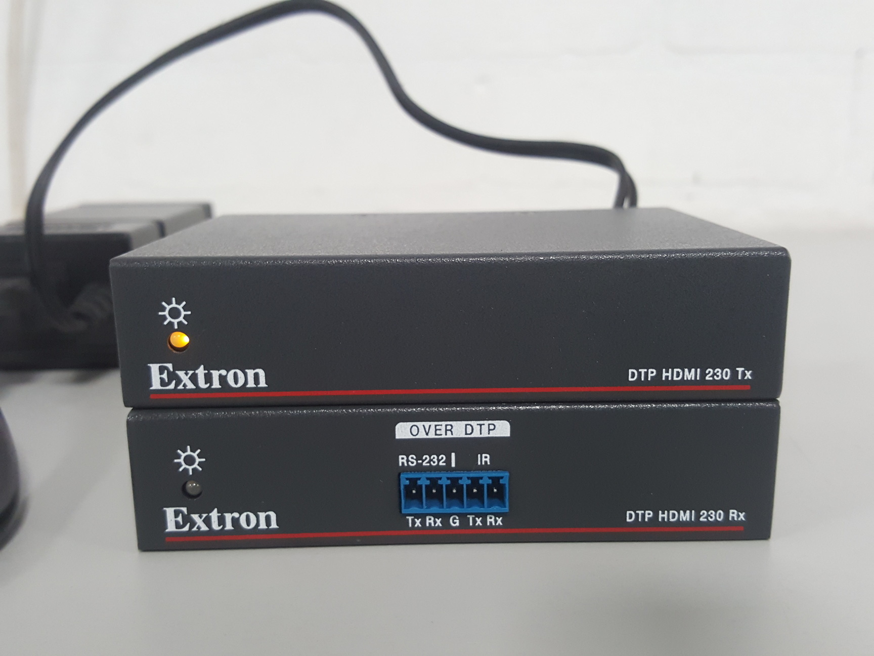 Image of 2x Extron DTP HDMI 230 Tx & DTP HDMI 230 Rx. Includes 1 x PSU & IEC cable