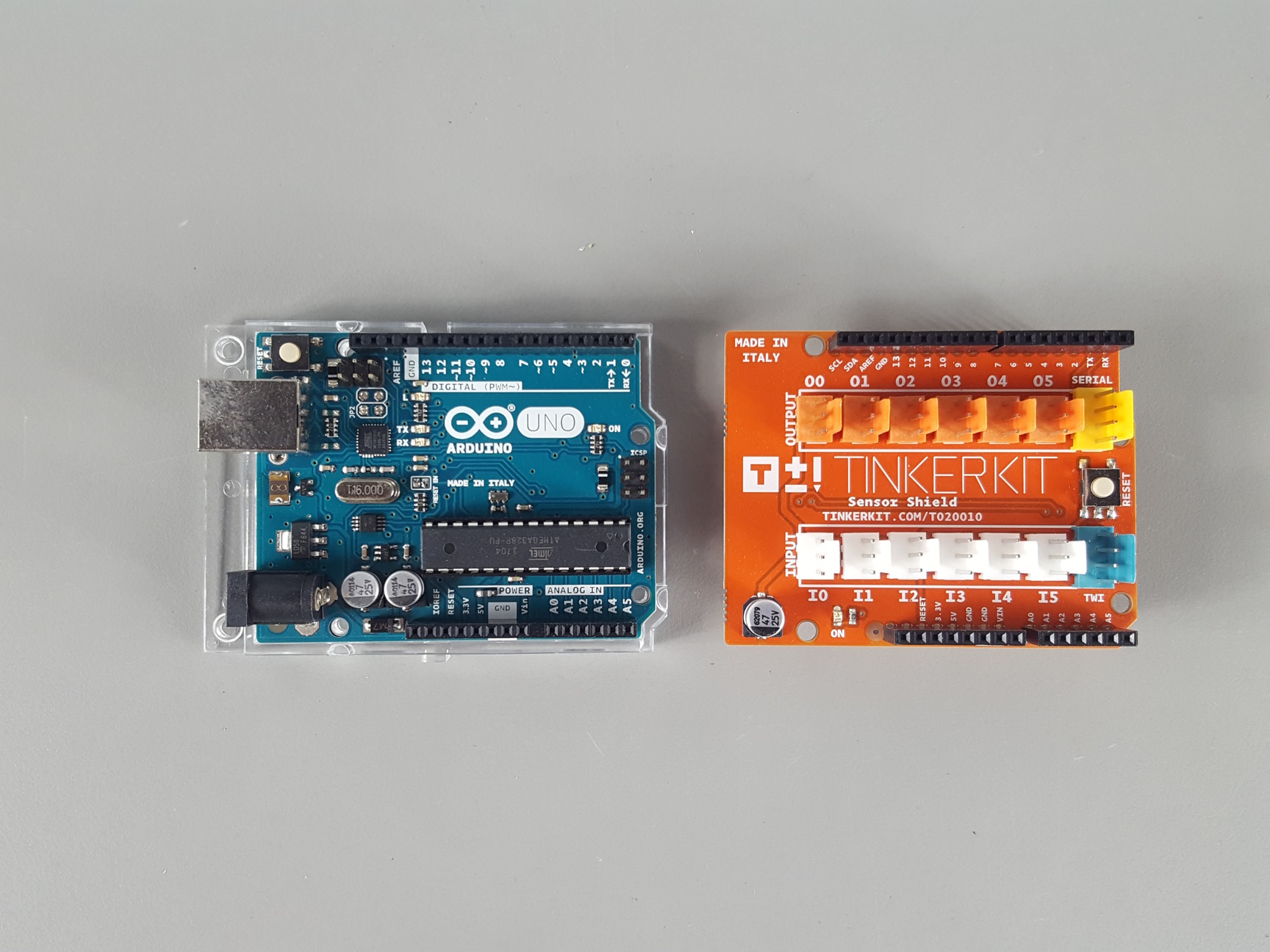 Image of Arduino Uno R3 & TinkerKit Sensor Shield Boards