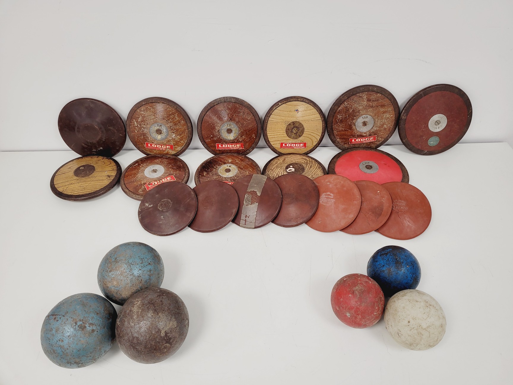 Image of Job Lot of Vintage Shot Put Balls and Discus Sports Athletics Equipment