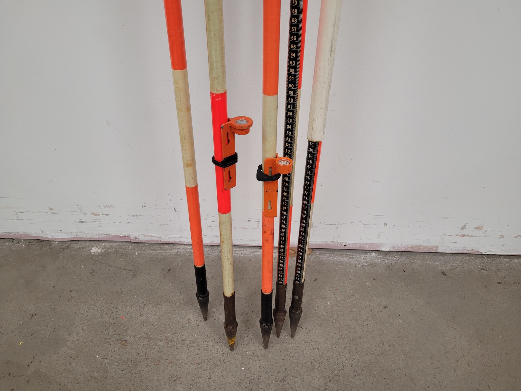 Large Lot of Surveying Equipment - Measuring Staffs, Rulers, Stakes, Sticks