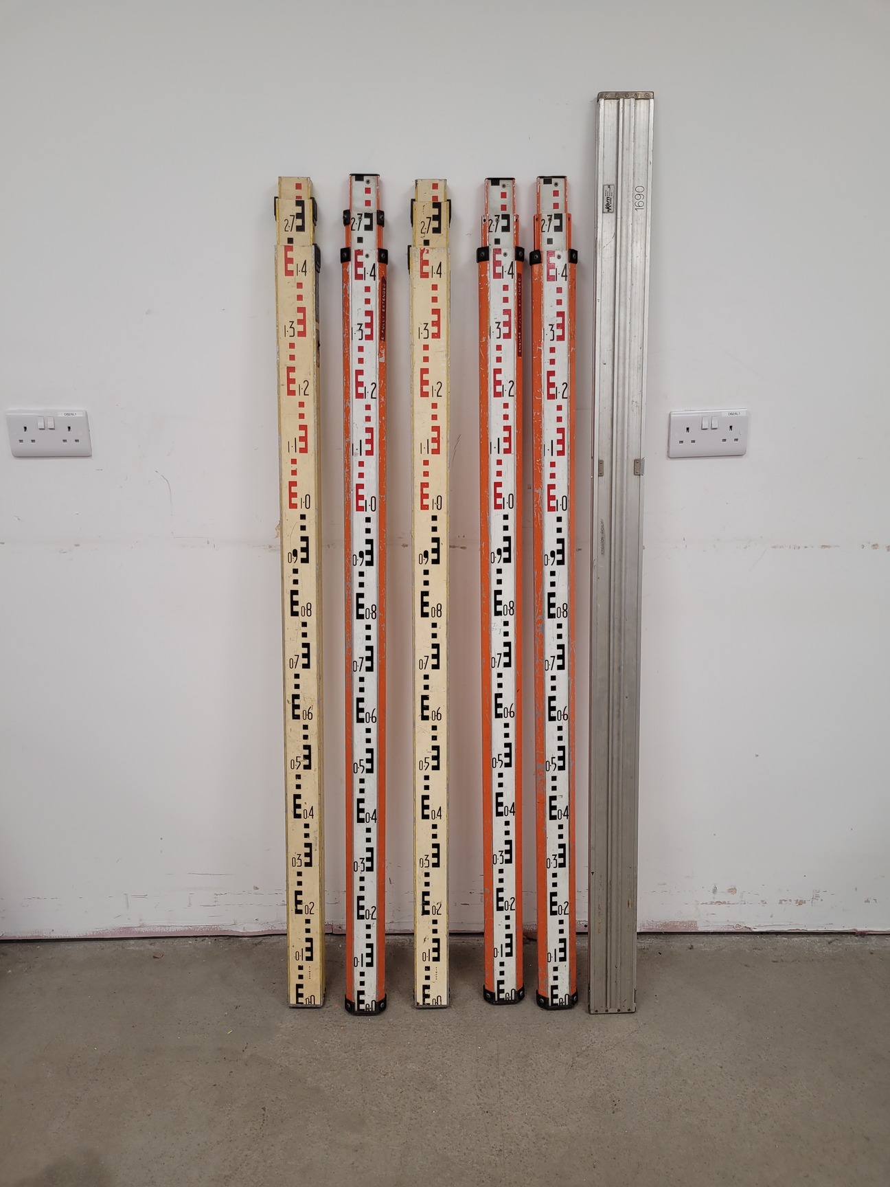 Large Lot of Surveying Equipment - Measuring Staffs, Rulers, Stakes, Sticks