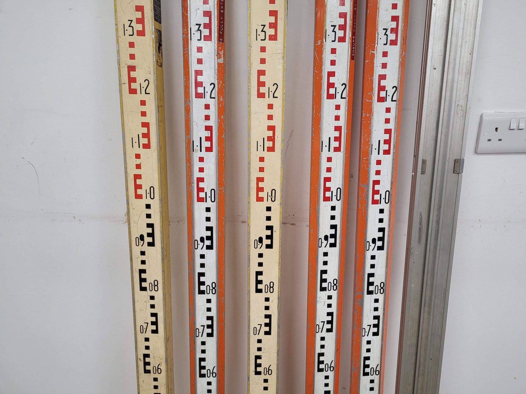 Large Lot of Surveying Equipment - Measuring Staffs, Rulers, Stakes, Sticks