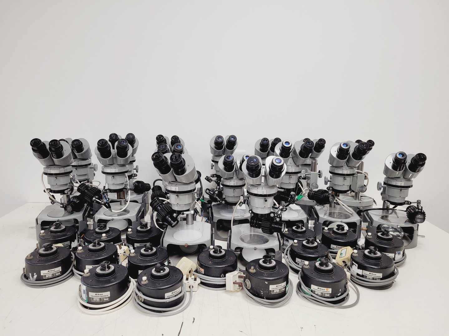 Image of Job Lot of 16 Grey Nikon Stereo Microscopes & Transformers Lab