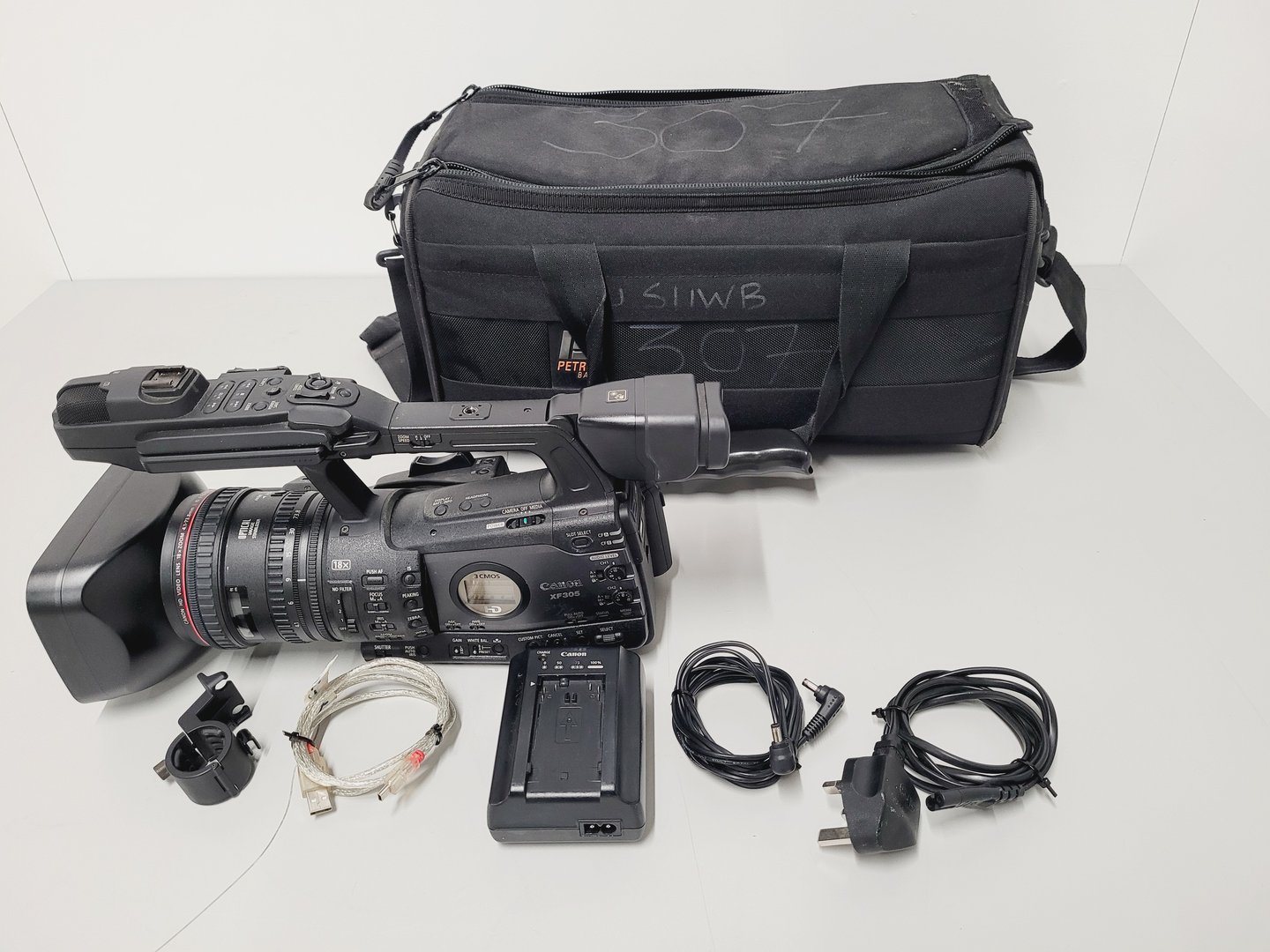 Image of Canon XF305 HD Video Camera Camcorder with Charger - Power Adapter