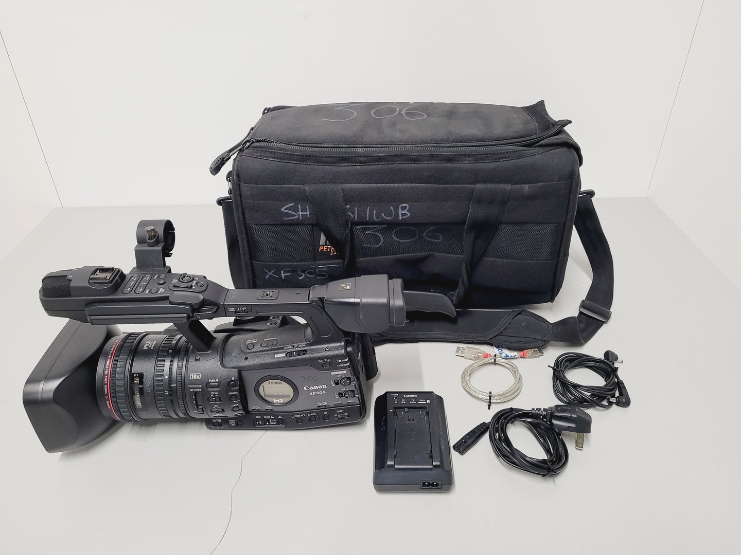 Image of Canon Model XF305 HD Video Camera Camcorder with Charger - Power Adapter