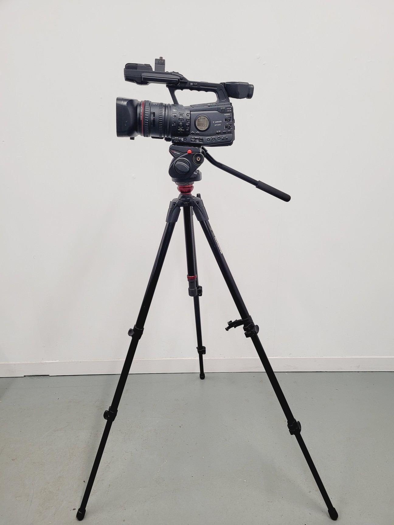 Image of Canon XF305 HD PAL Video/Camera Camcorder and Manfrotto 755XB Tripod