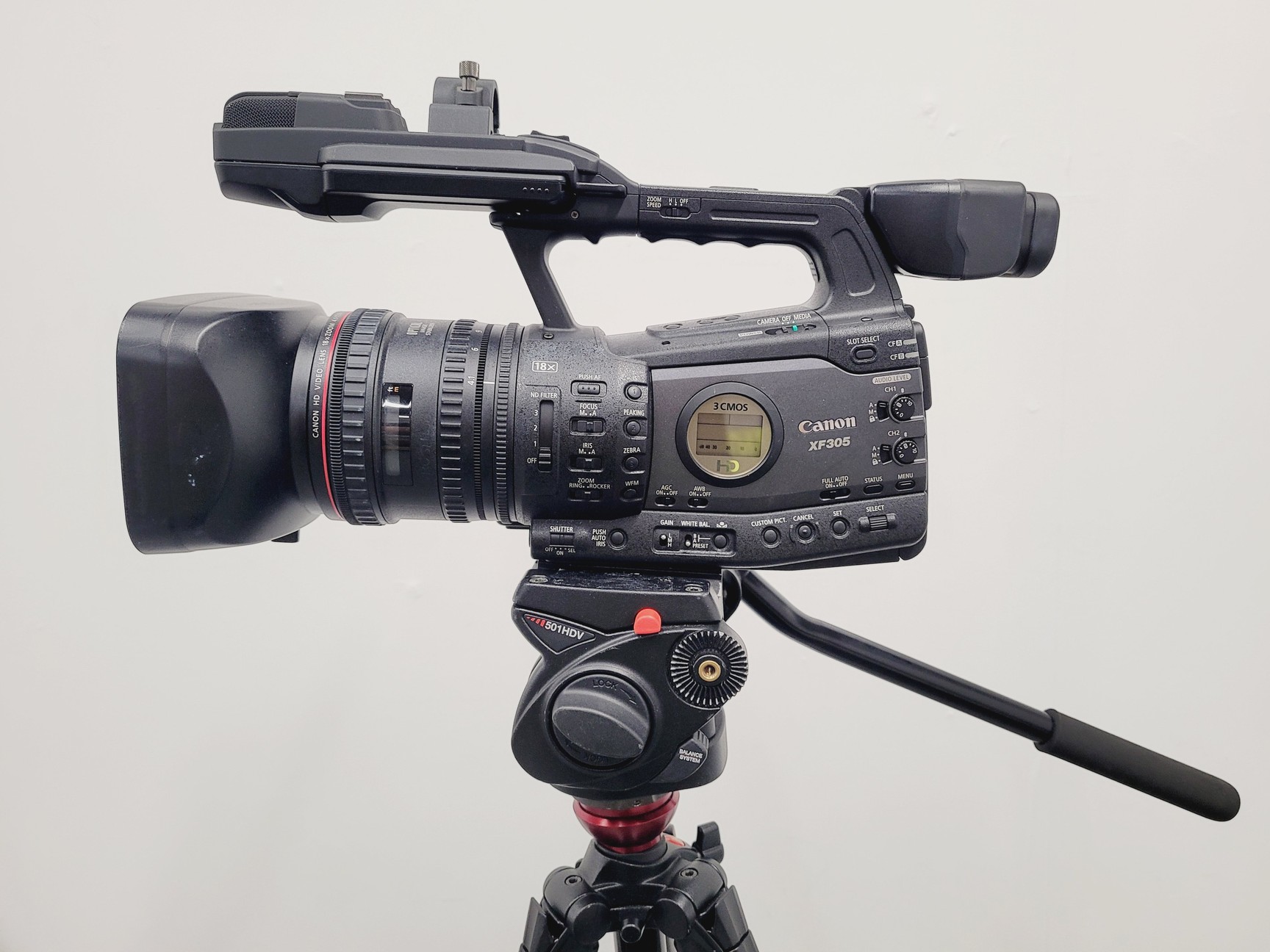 Image of Canon XF305 HD PAL Video/Camera Camcorder and Manfrotto 755XB Tripod