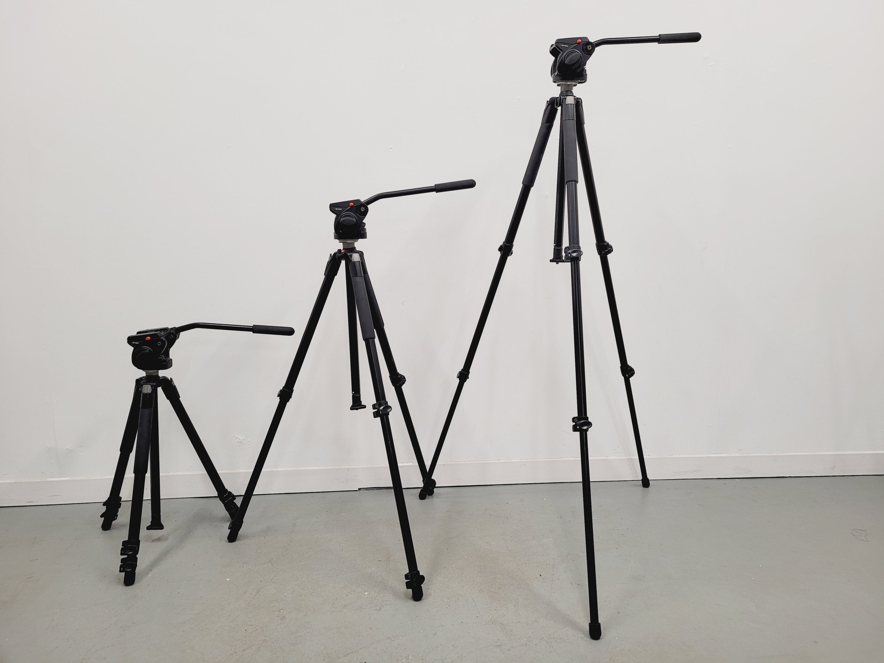 Image of Job Lot of 22 Camera Tripods and Heads Manfrotto Libec With Carry Bags